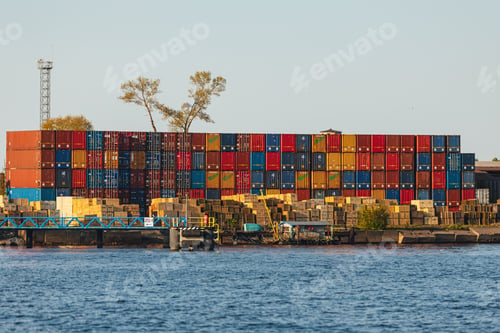 Preview: Cargo vessel in the ocean, with a large number of cargo containers in the vicinity