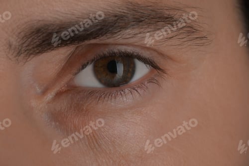 Preview: Evil eye. Man with scary eyes, closeup view