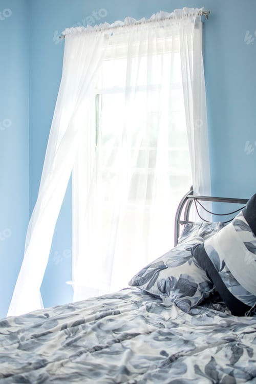 Preview: Open window air blowing curtains around in a blue floral room