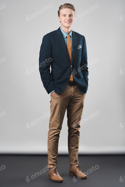 Preview: happy handsome young businessman in stylish modern suit