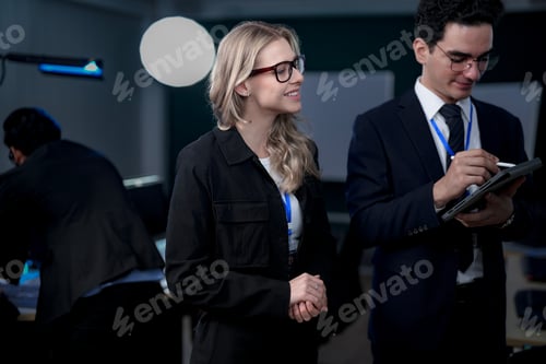 Preview: software developers smile with satisfaction during a pair programming session
