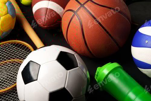 Preview: Various sports equipment on black background studio shot