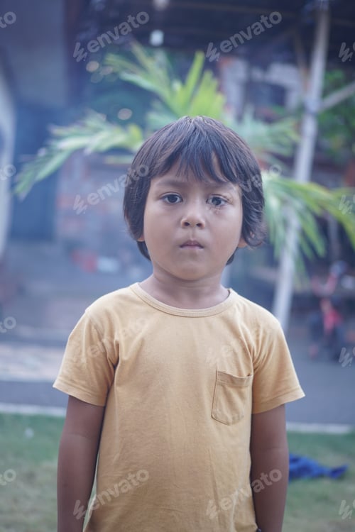 Preview: little boy wearing yellow shirt