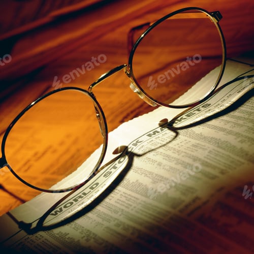 Preview: Stock Market Newspaper with Reading Glasses on Top