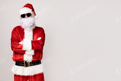 Preview: Cool Santa Claus in sunglasses on a light background.