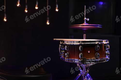 Preview: Snare drum on dark blurred background close up.