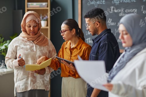 Preview: Multiethnic Young Adults Collaborating during Language School Group Activity