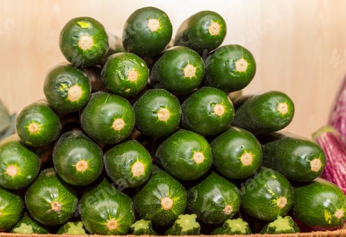 Preview: A stack of cucumbers in a wooden box