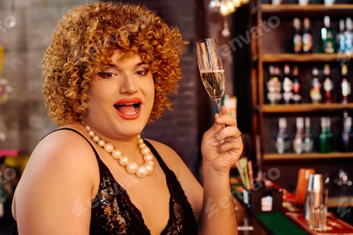 Preview: Bold drag queen captivates audience during festive holiday performance on stage