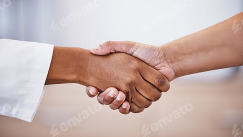 Preview: Doctor, handshake and meeting in thank you for healthcare, agreement or deal at hospital. Medical p