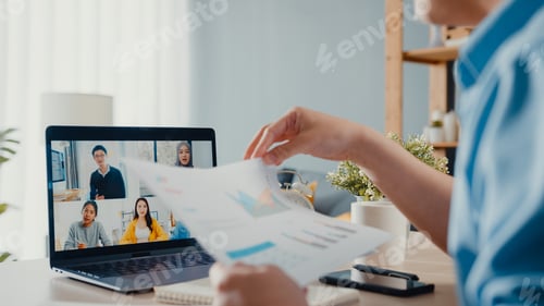 Preview: Asia businessman using laptop talk to colleagues about plan in video call meeting.