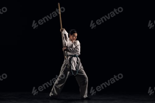 Preview: Woman in kimono practicing with jodo