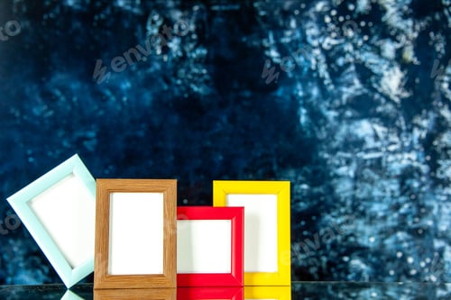 Preview: front view different picture frames with colored corners on the dark background present family photo