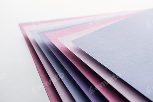 Preview: blue, white, pink and purple sheets of paper on white background