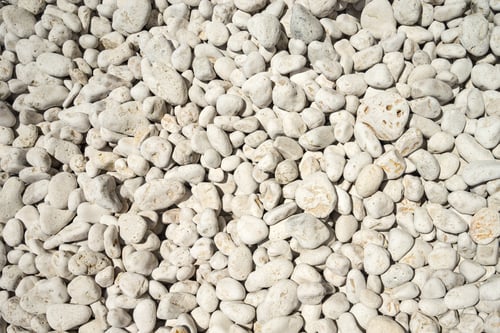 Preview: Naturally polished white rock pebbles background