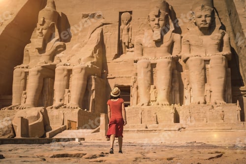 Preview: A young tourist in a red dress entering the Abu Simbel Temple in southern Egypt