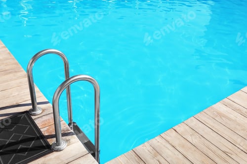 Preview: Modern swimming pool with step ladder outdoors