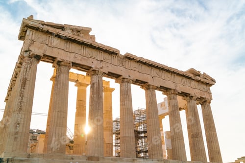 Preview: Golden hour sunlight filters through the ancient columns of the Parthenon