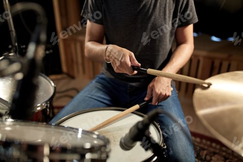 Preview: male musician playing drums and cymbals at concert