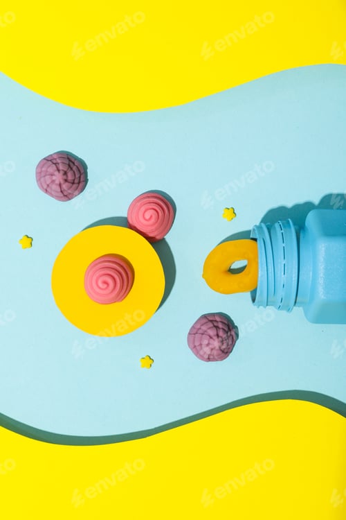 Preview: Jelly candies, blue jar on blue-yellow background, top view