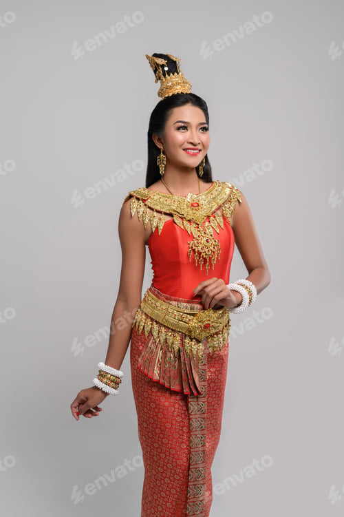 Preview: Beautiful Thai woman wearing Thai dress and looking at the top