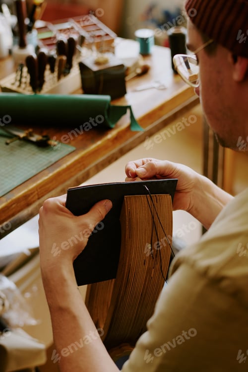 Preview: Male Tailor Sewing in Atelier