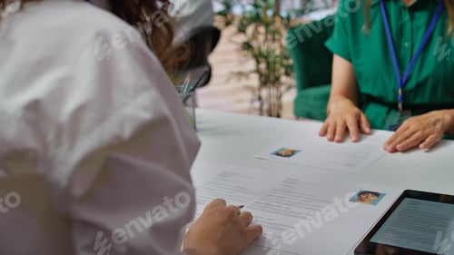 Preview: HR staff going through the selection process phase of the recruitment activity