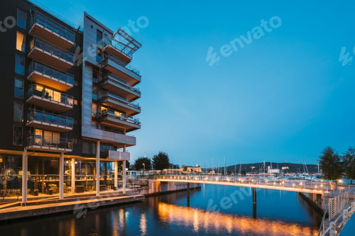 Preview: Oslo, Norway. Night View Of Residential Multi-storey Houses In Aker Brygge District. Summer Evening