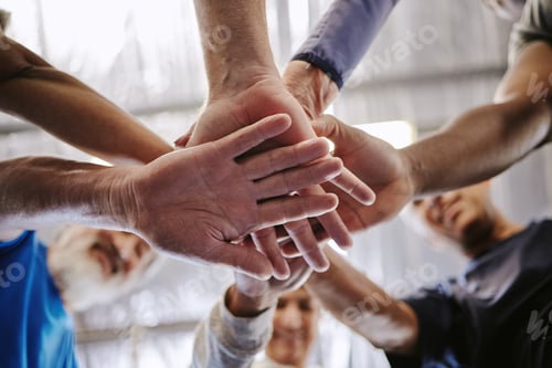 Preview: Teamwork, hands together and low angle of people in gym for motivation, solidarity and team buildin