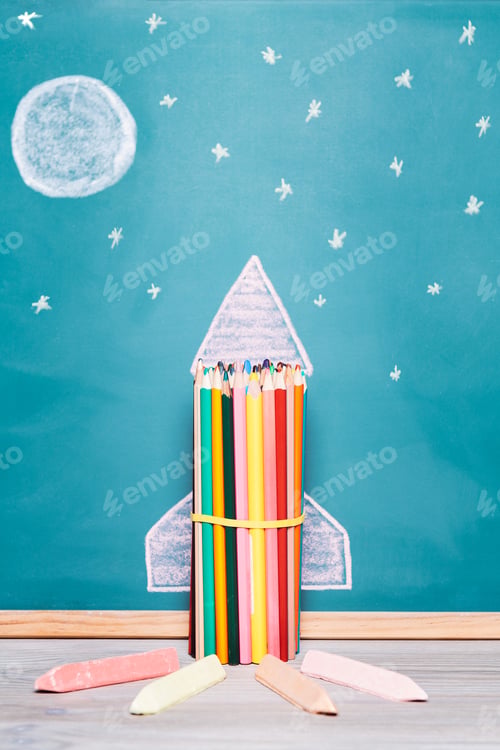 Preview: rocket made with crayons and drawn on a blackboard
