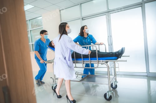 Preview: Emergency department, doctors and surgeons team move seriously injured patient lying