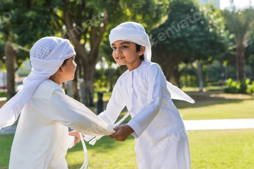Preview: children playing together in Dubai in the park.