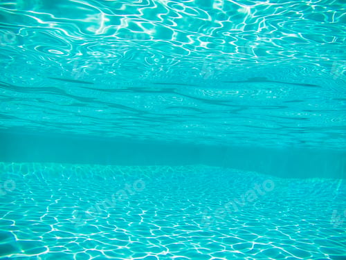 Preview: Swimming pool underwater with bright sun light rays or caustics, background or texture.