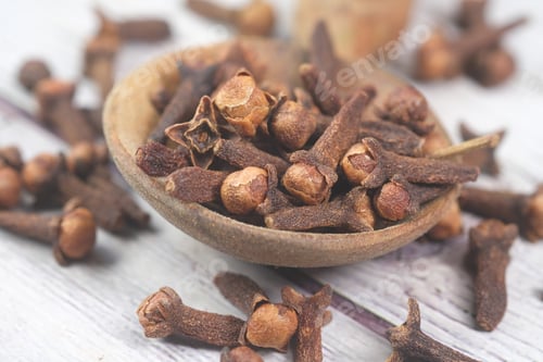 Preview: cloves on a spoon on table close up
