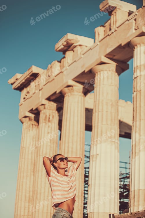 Preview: Happy girl tourist visits Acropolis. Greece