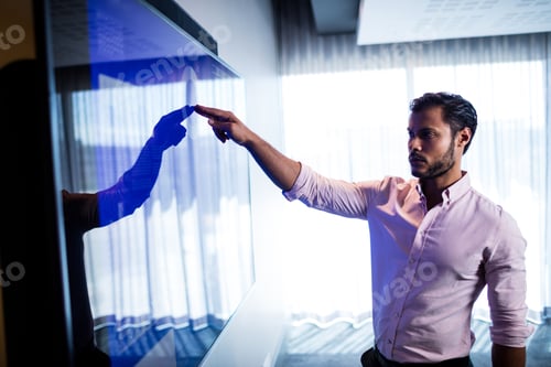 Preview: Businessman using touch screen