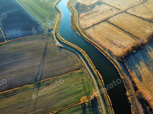 Preview: Drone shot of a river in a field