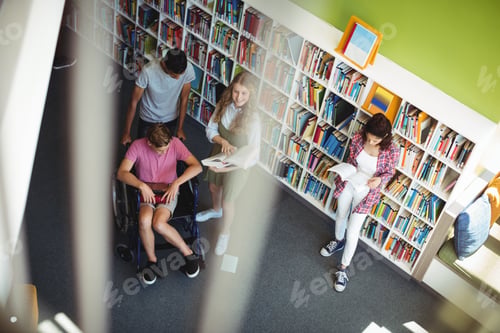 Preview: Students interacting with each other in library