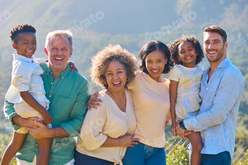 Preview: Portrait Of Three Generation Family Laughing And Smiling Standing Outdoors In Countryside