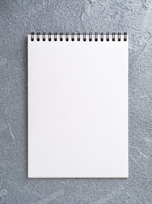 Preview: blank sheet of notebook with a spiral on a neutral gray textured silver metallic background