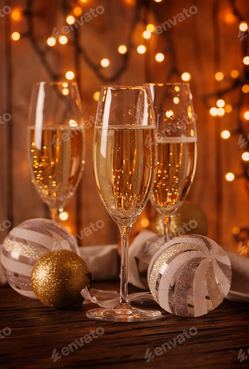 Preview: Glasses of champagne on the christmas background