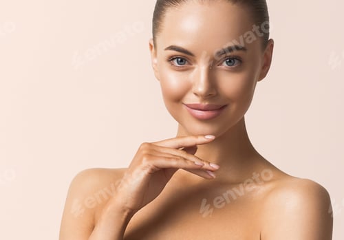 Woman's Beautiful Face with Hand Under Chin