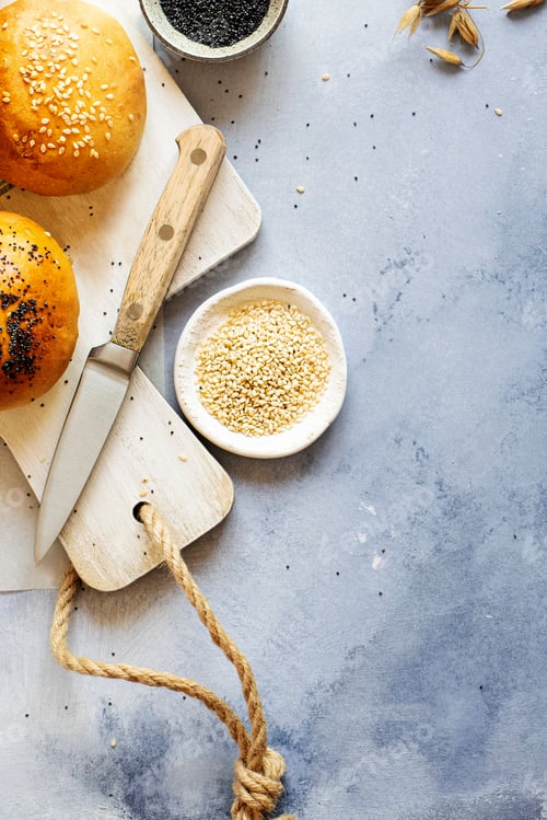 Preview: Fresh bread rolls on a cutting board