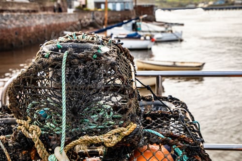 Preview: Pile of old crab traps and fishing nets stacked on one another
