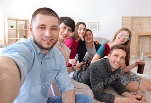 Preview: Happy friends taking selfie indoors