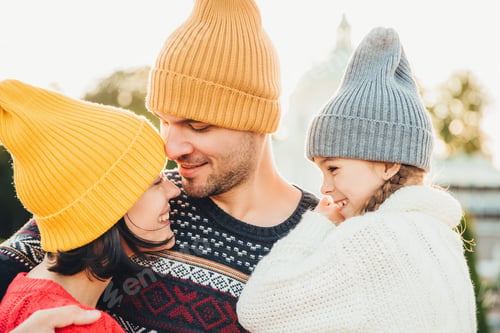 Preview: Three family members stand close to each other, look with eyes full of love and happiness