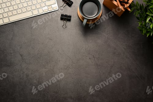 Preview: Stylish workspace with a cup of coffee and keyboard on dark grey stone background
