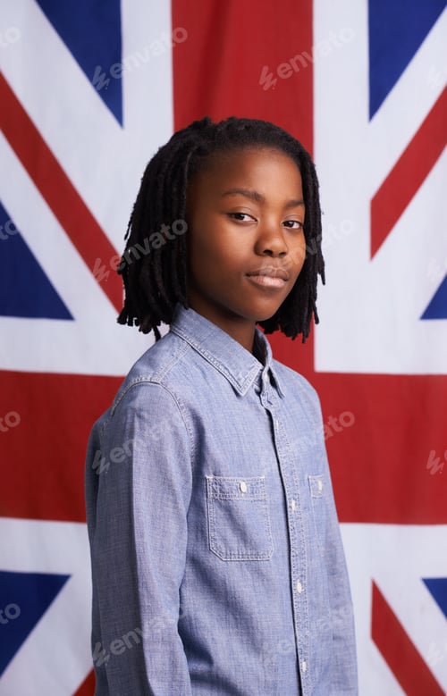 Preview: National pride. Portrait of a proud young boy standing in front of the Union Jack.
