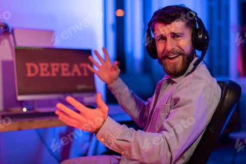 Preview: Frustrated gamer reacts to defeat in neon light