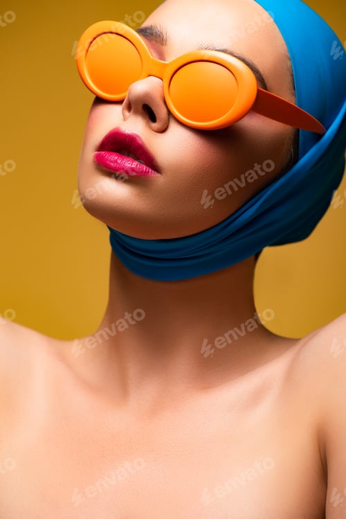 Preview: attractive fashionable girl in scarf and trendy sunglasses, isolated on yellow